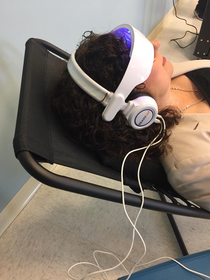 woman wearing relaxation technology glasses by BrainFit